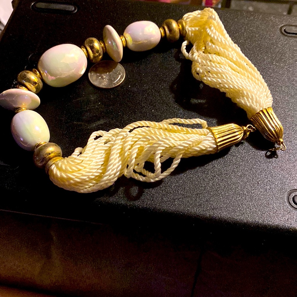Very bold statement necklace beige in color